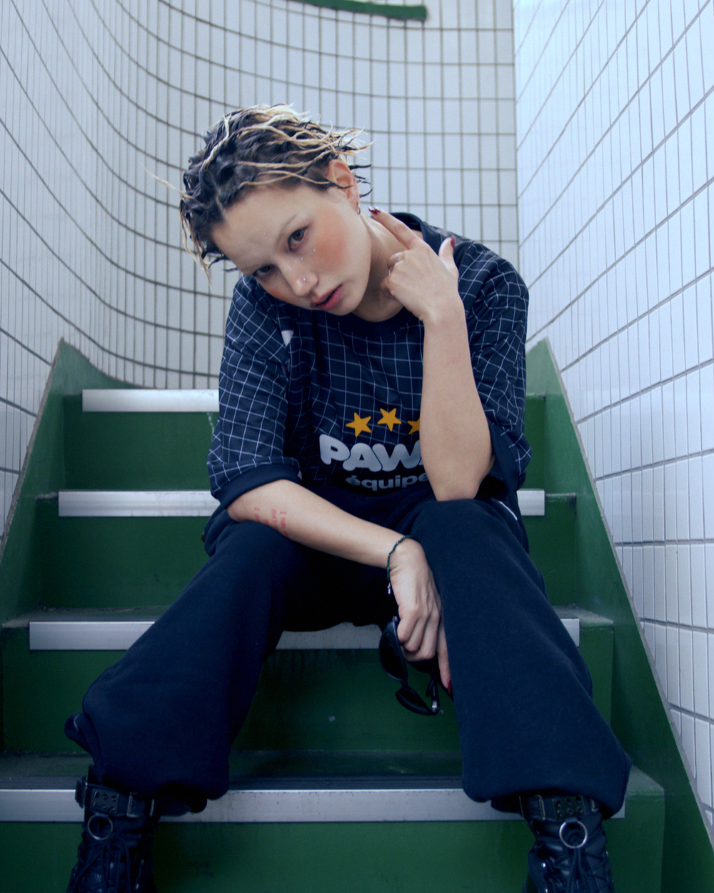Pawa Speed Sports Equipe Football Shirt in black, worn on Tokyo subway stairs, Season 5 lookbook